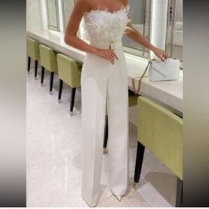 White feathered jumpsuit.  Brand new